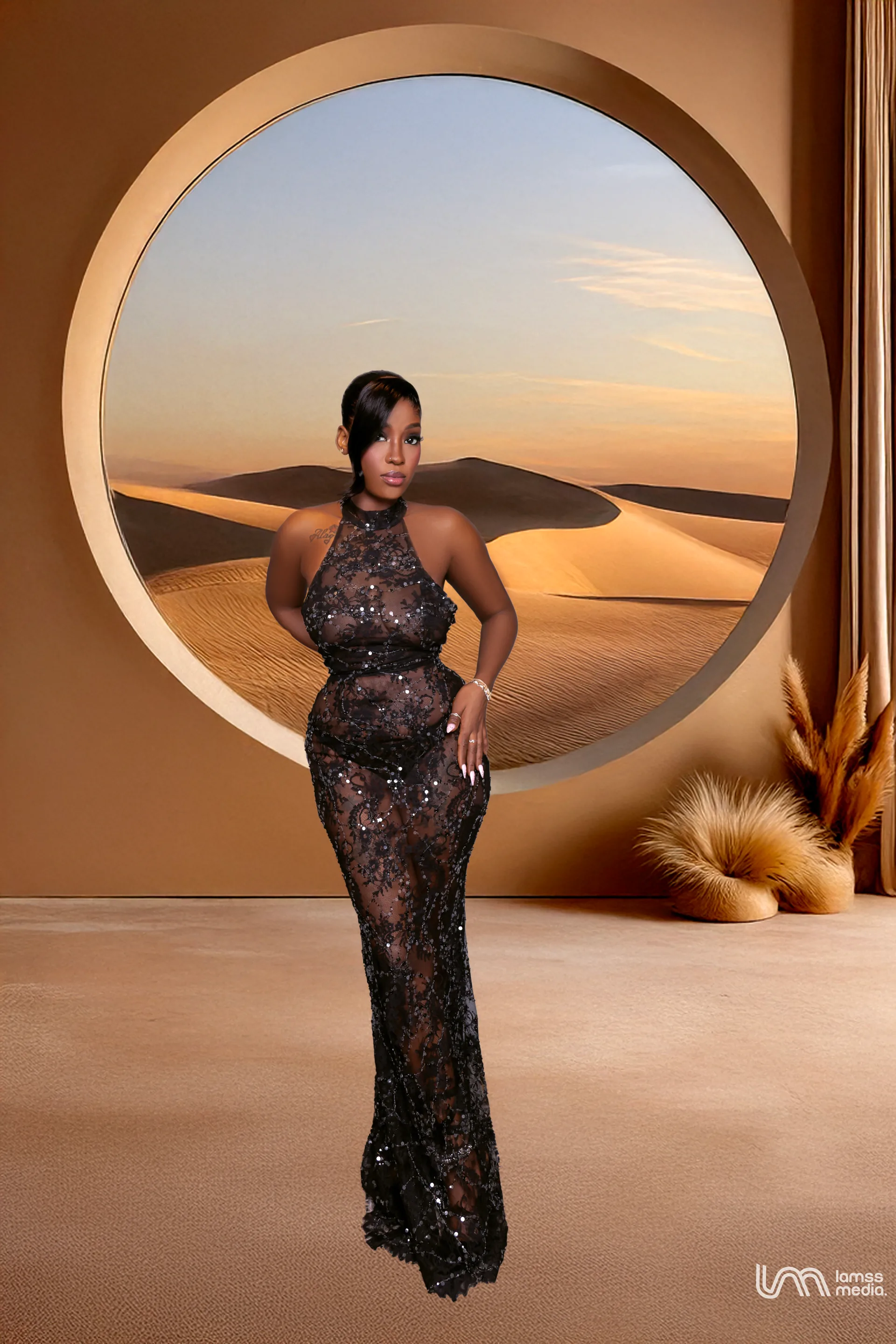 A woman in a black lace dress posing in front of a circular window overlooking a desert landscape. — portrait photography London by Lamss Media